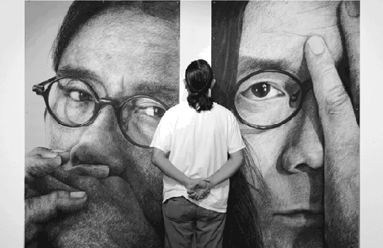 two large charcoal drawings of Ben Sum